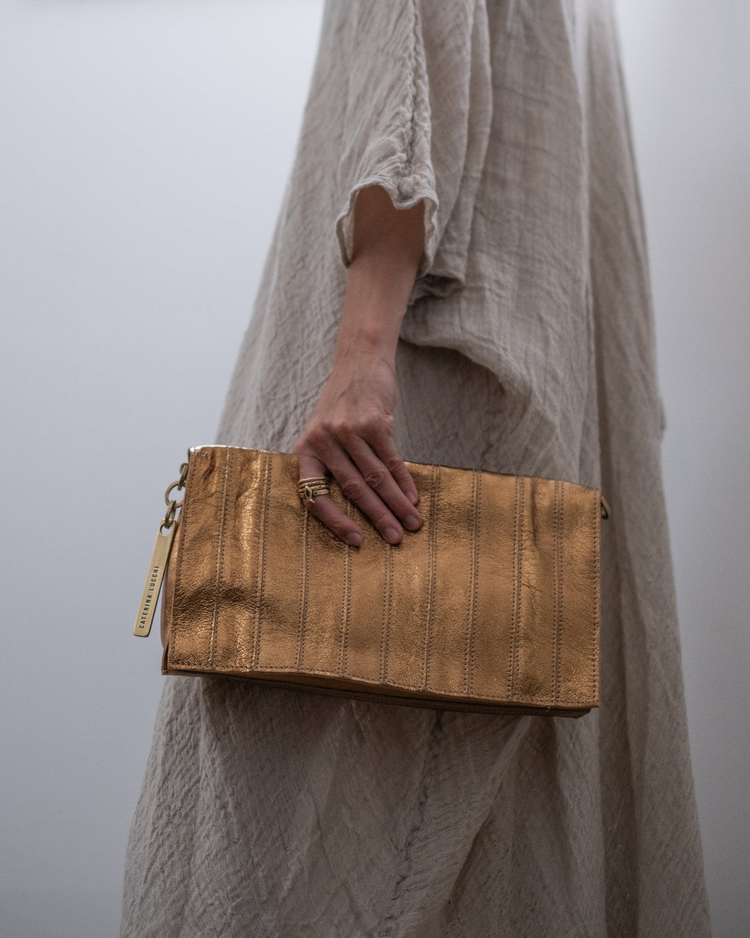 ELIDE - LAMINATED STRIPES POCHETTE - La Casa by Importante